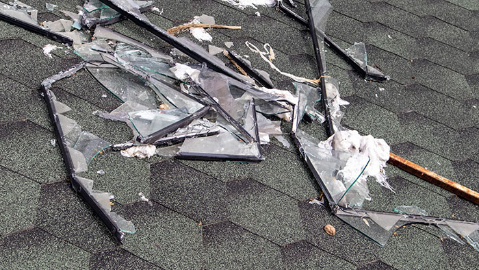 Broken roof after a storm. A large building with a damaged roof